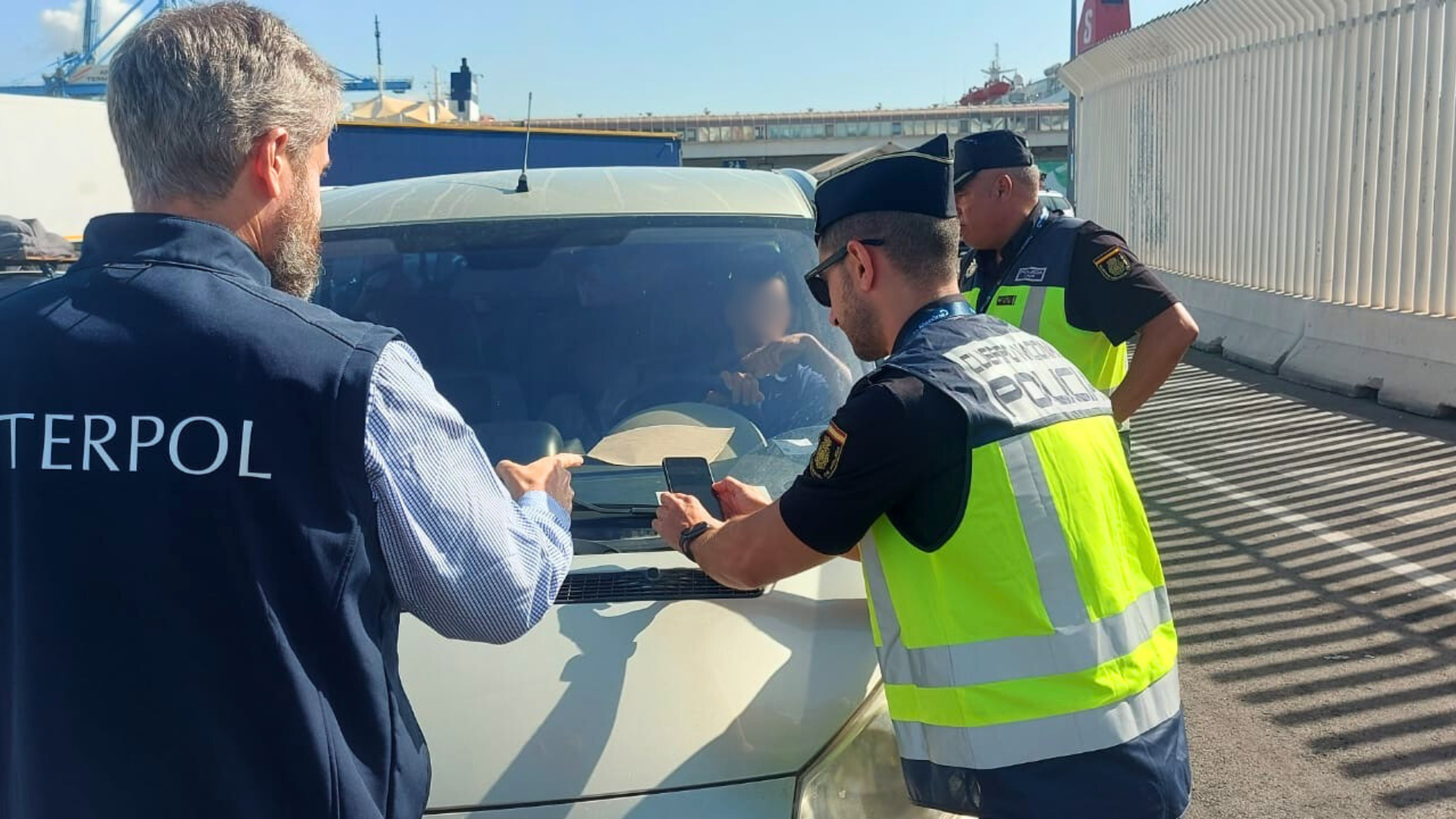 Spain 5_ Interpol officer assisting - Edited.png